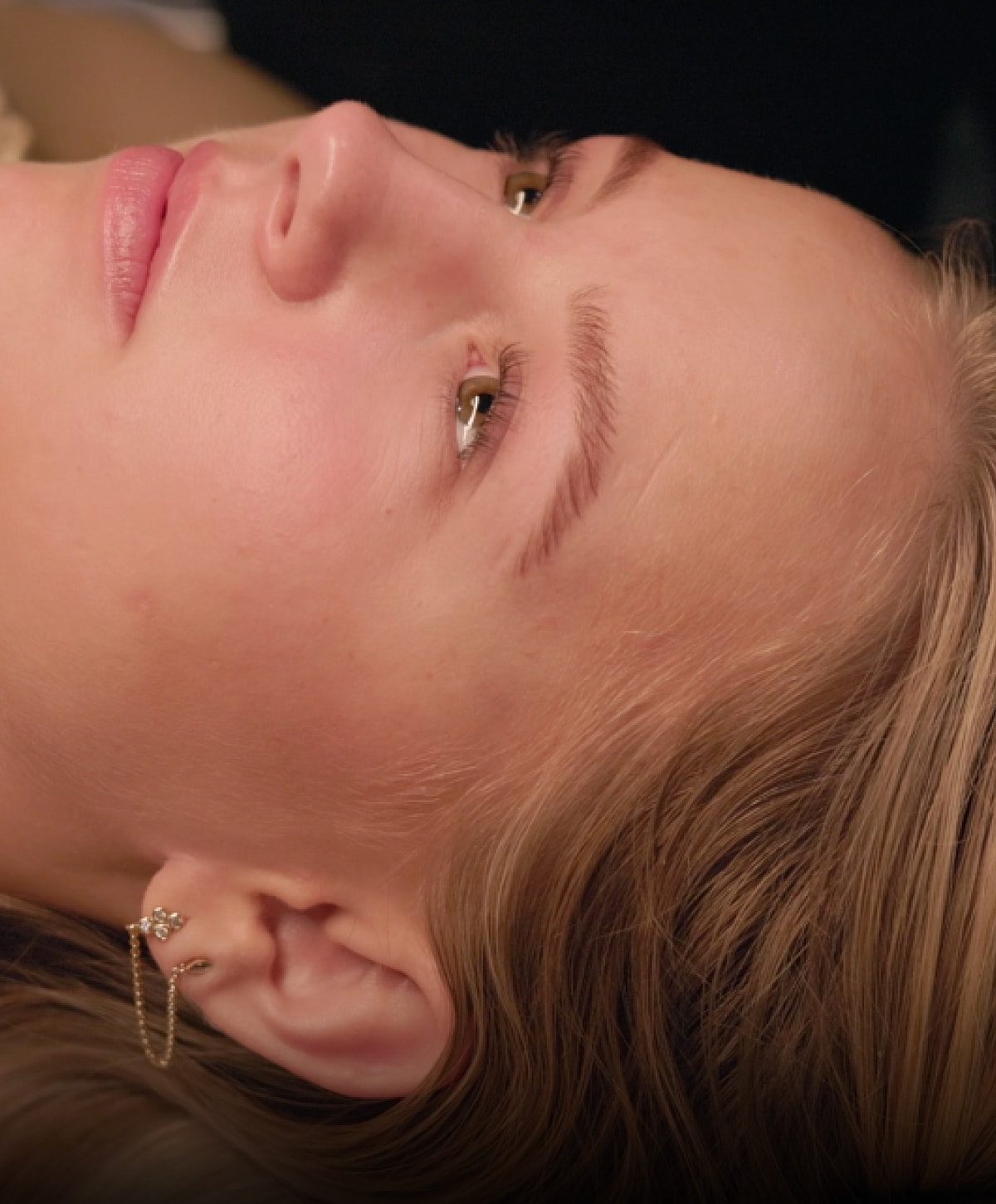 Close-up of a woman's face with soft features.