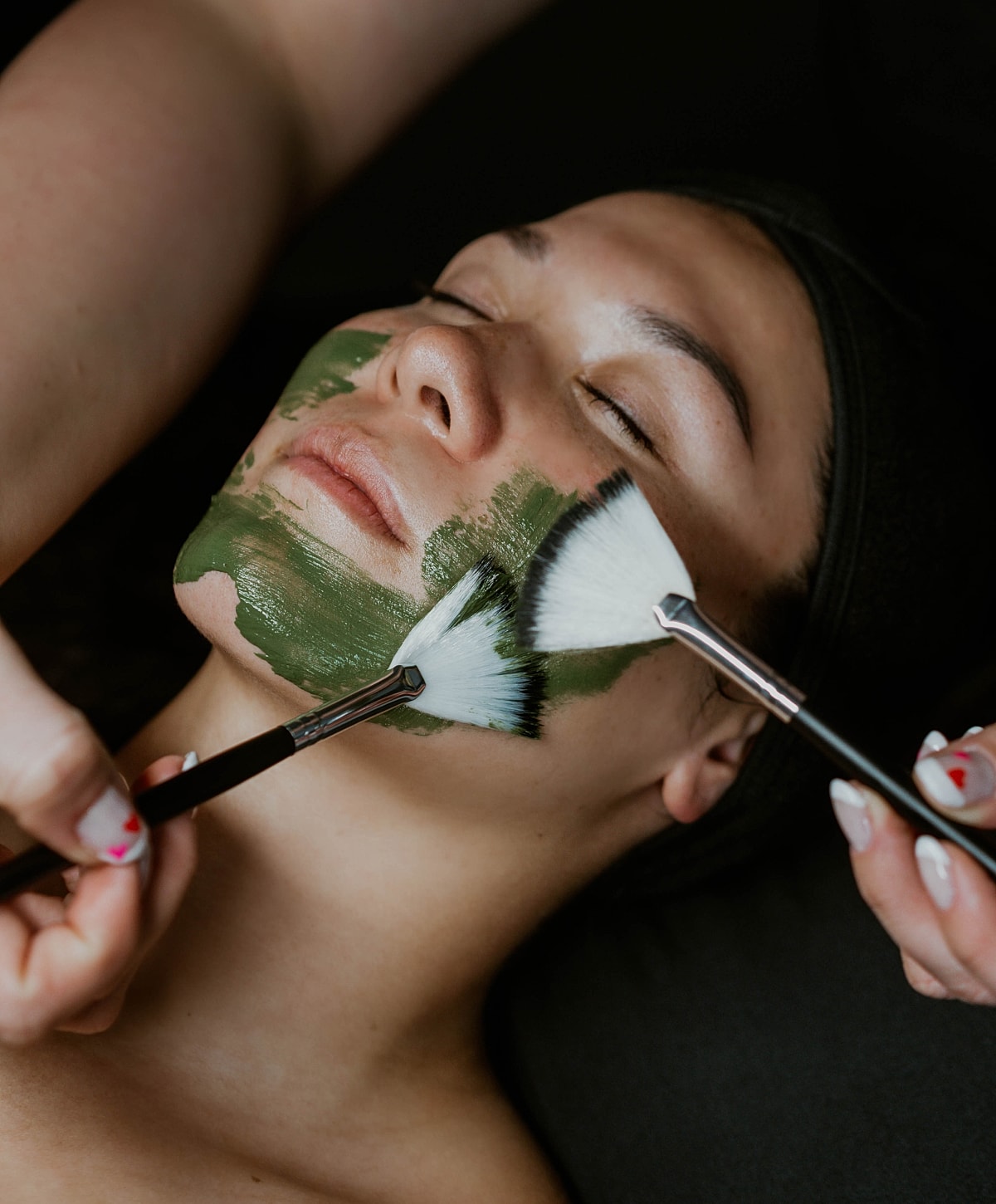 Woman enjoying a facial treatment with steam.