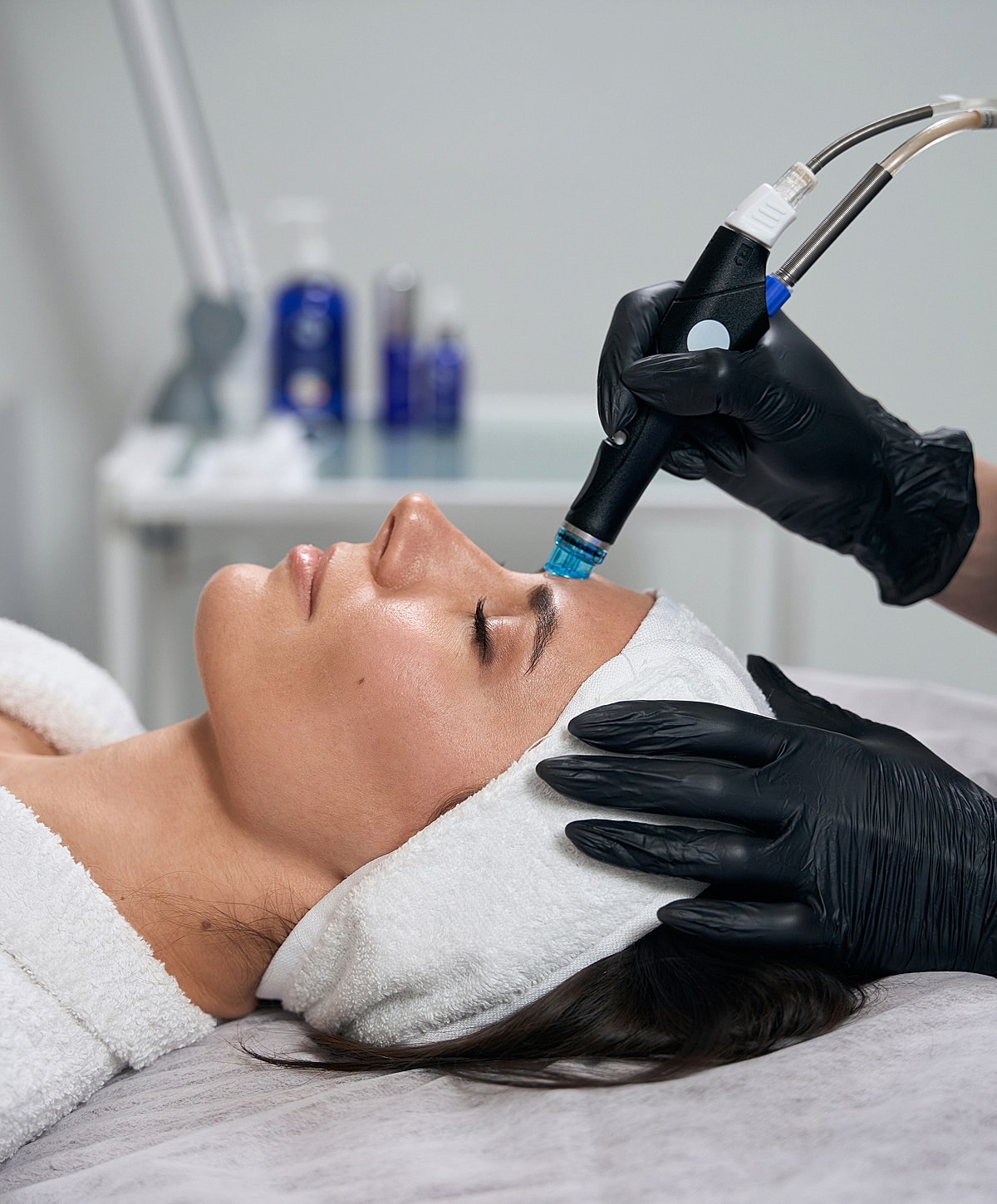 Woman receiving a facial treatment procedure.