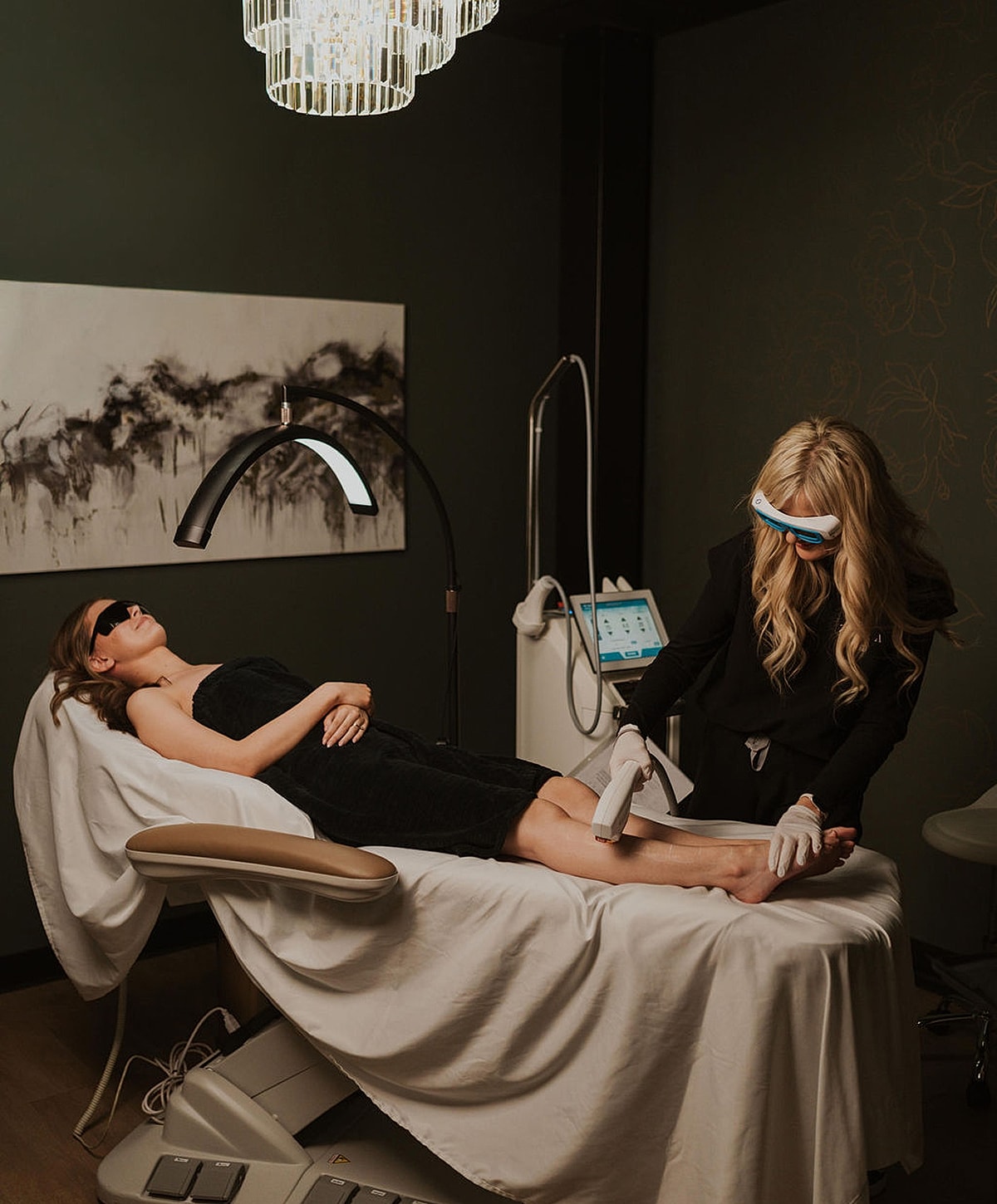 Woman receiving skincare treatment in a spa.