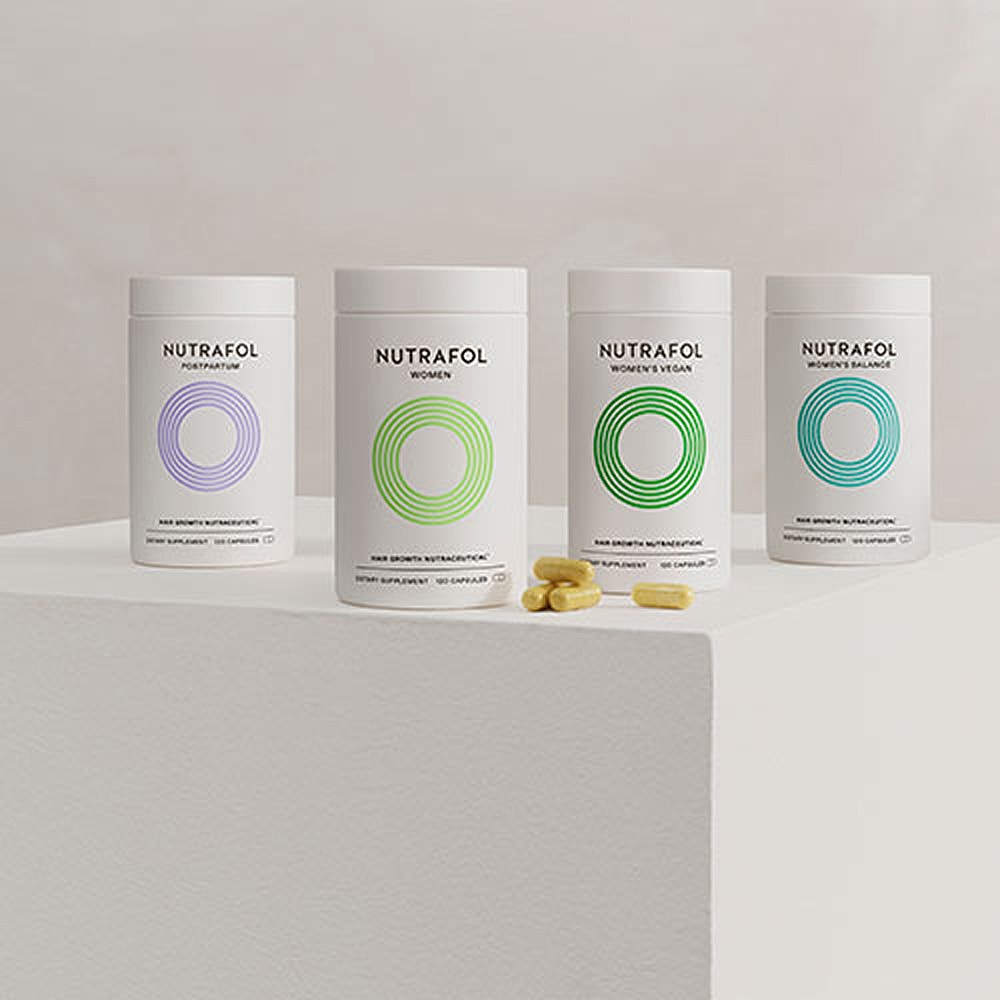 Nutrafol hair growth supplement bottles on display