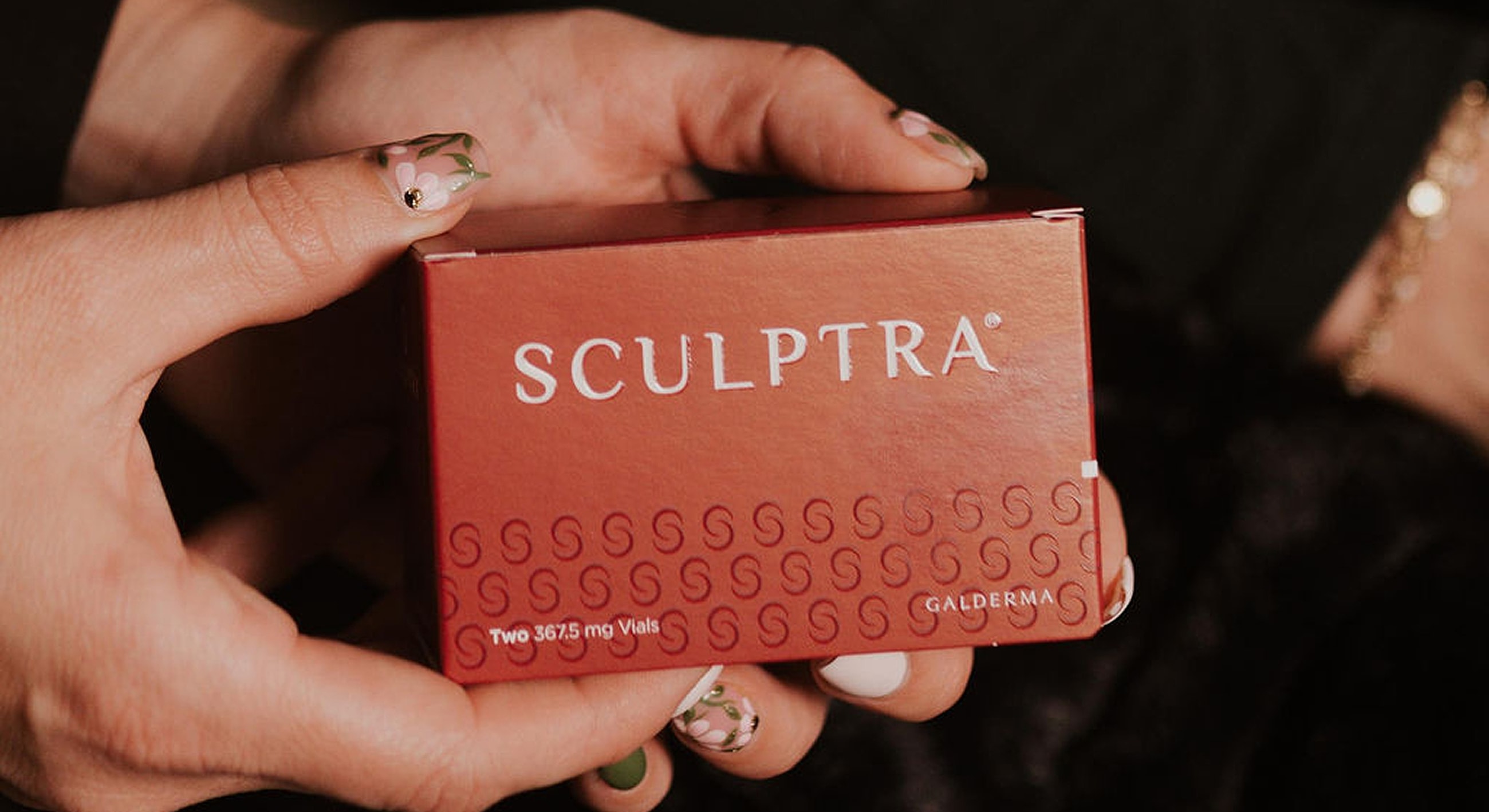 Sculptra product packaging held in hand
