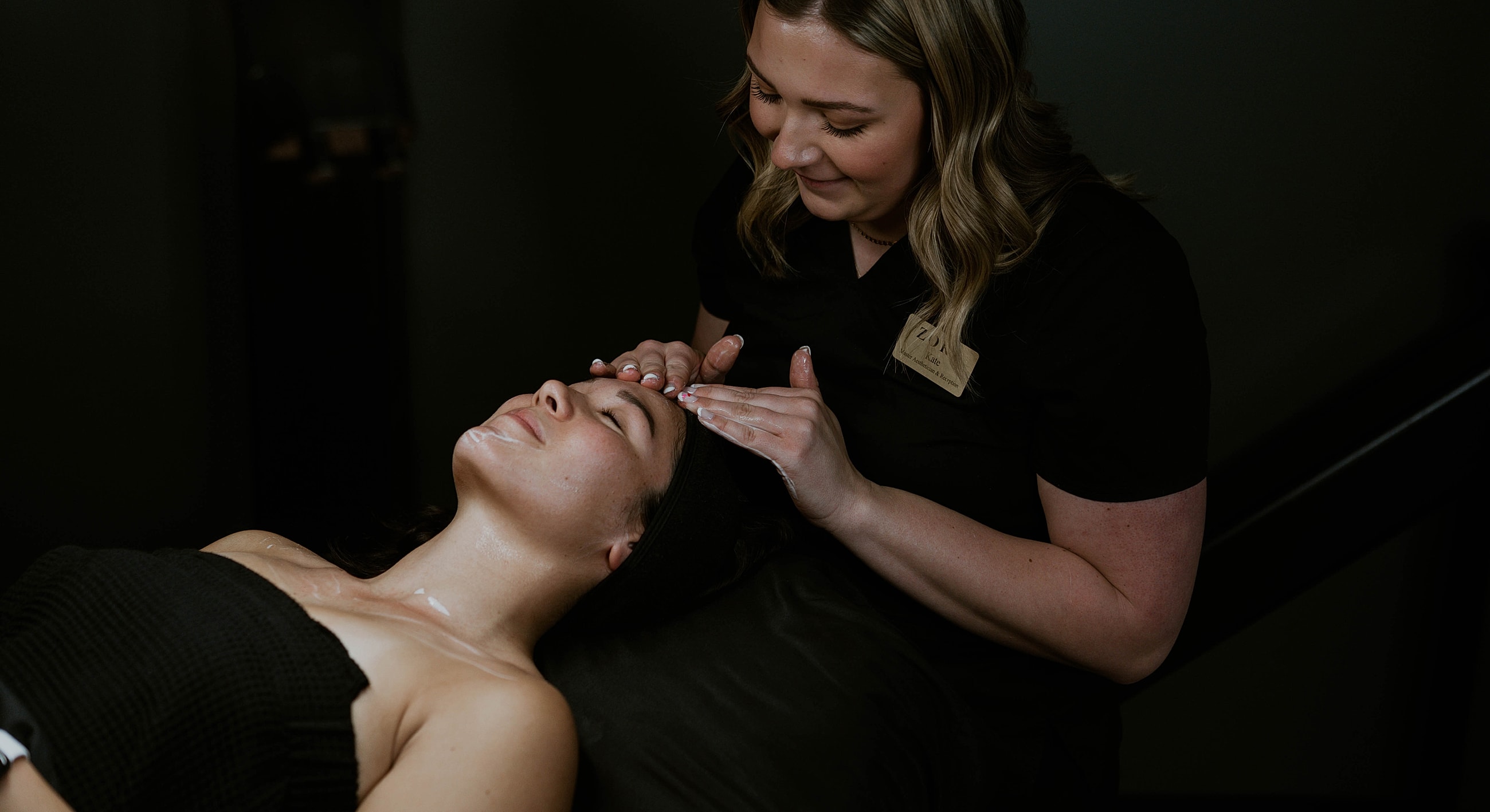 Woman receiving a facial treatment with steam.