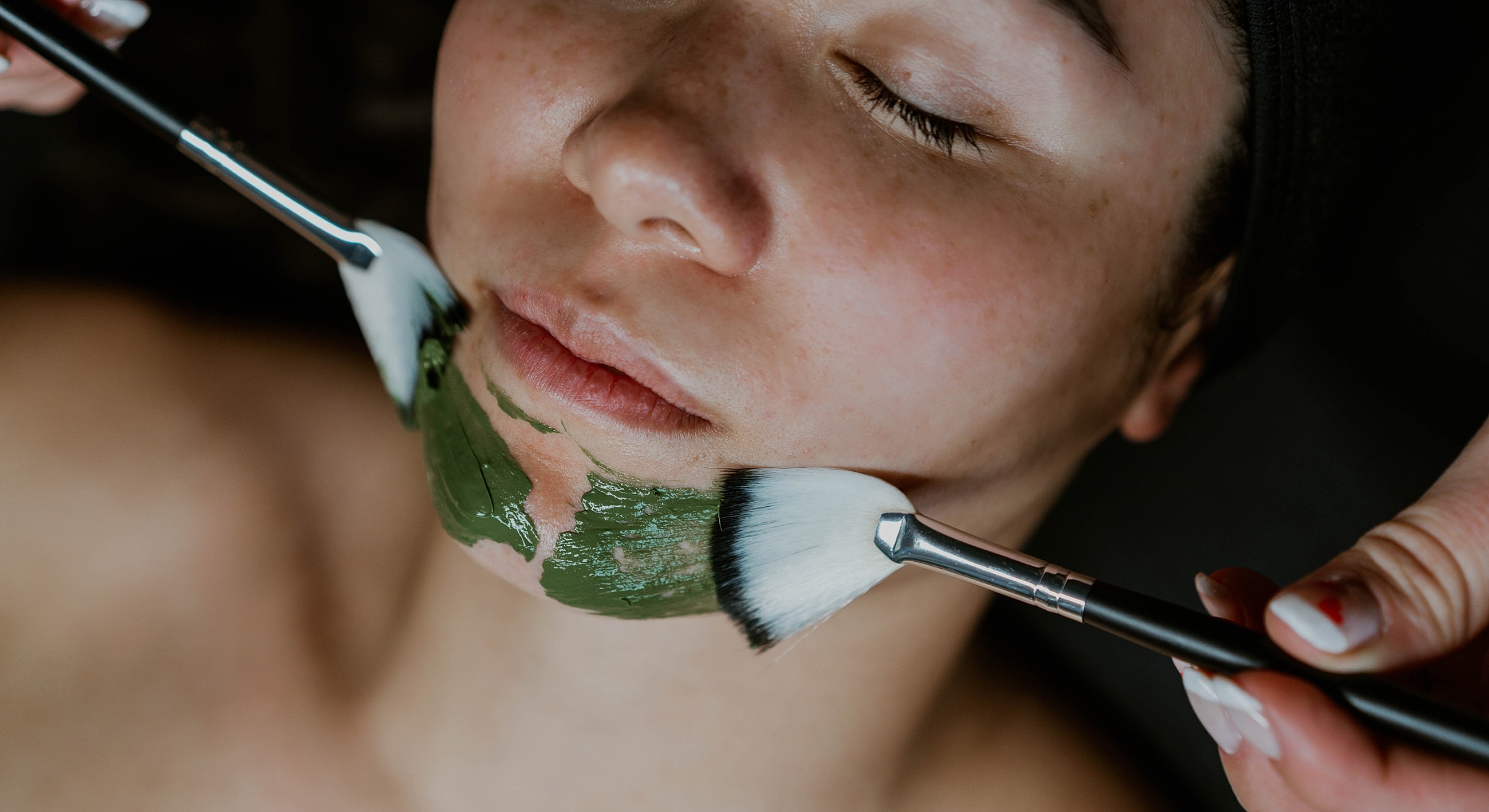 Facial treatment in a serene spa environment.