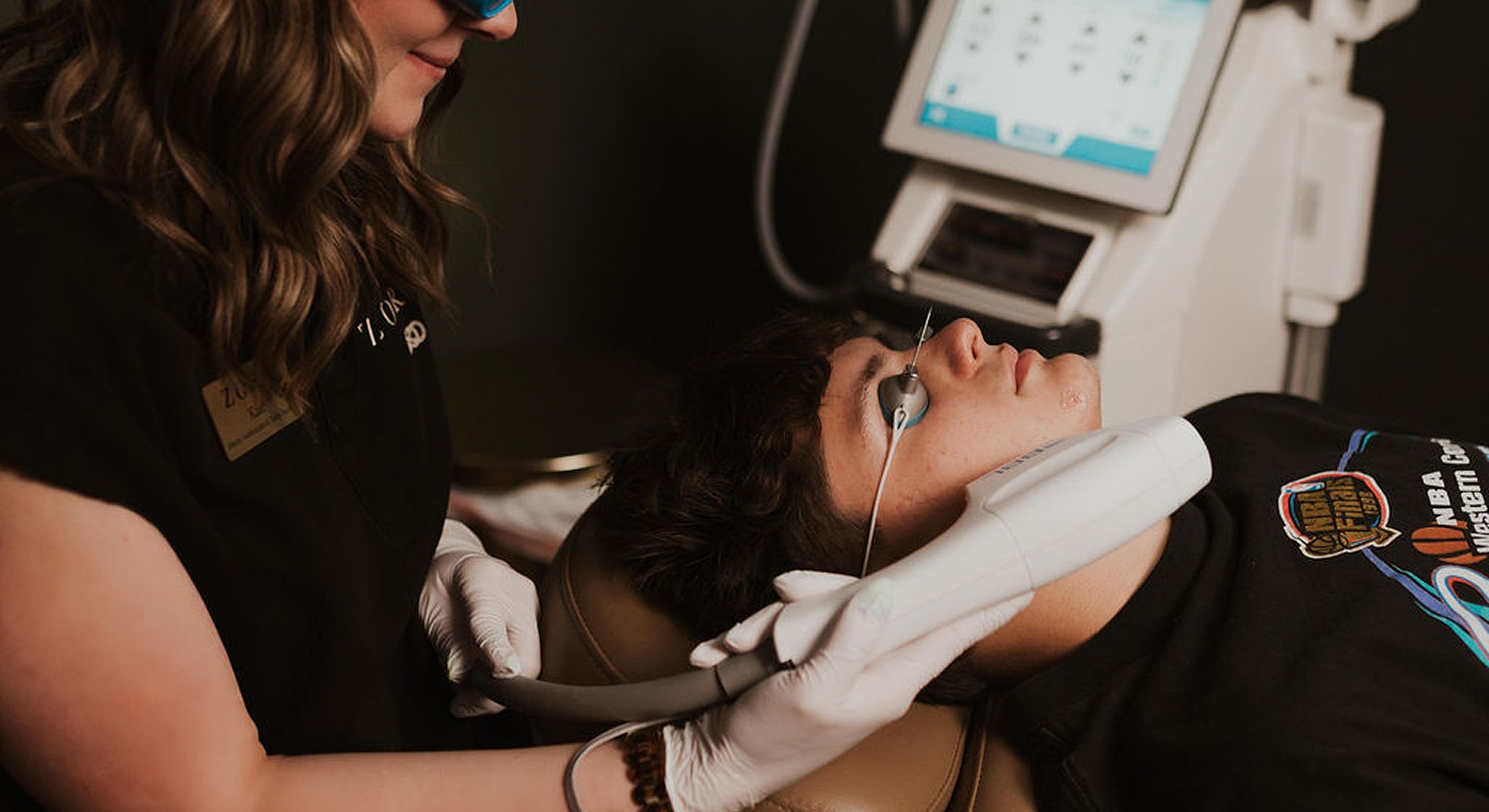 Patient receiving a facial treatment at clinic.