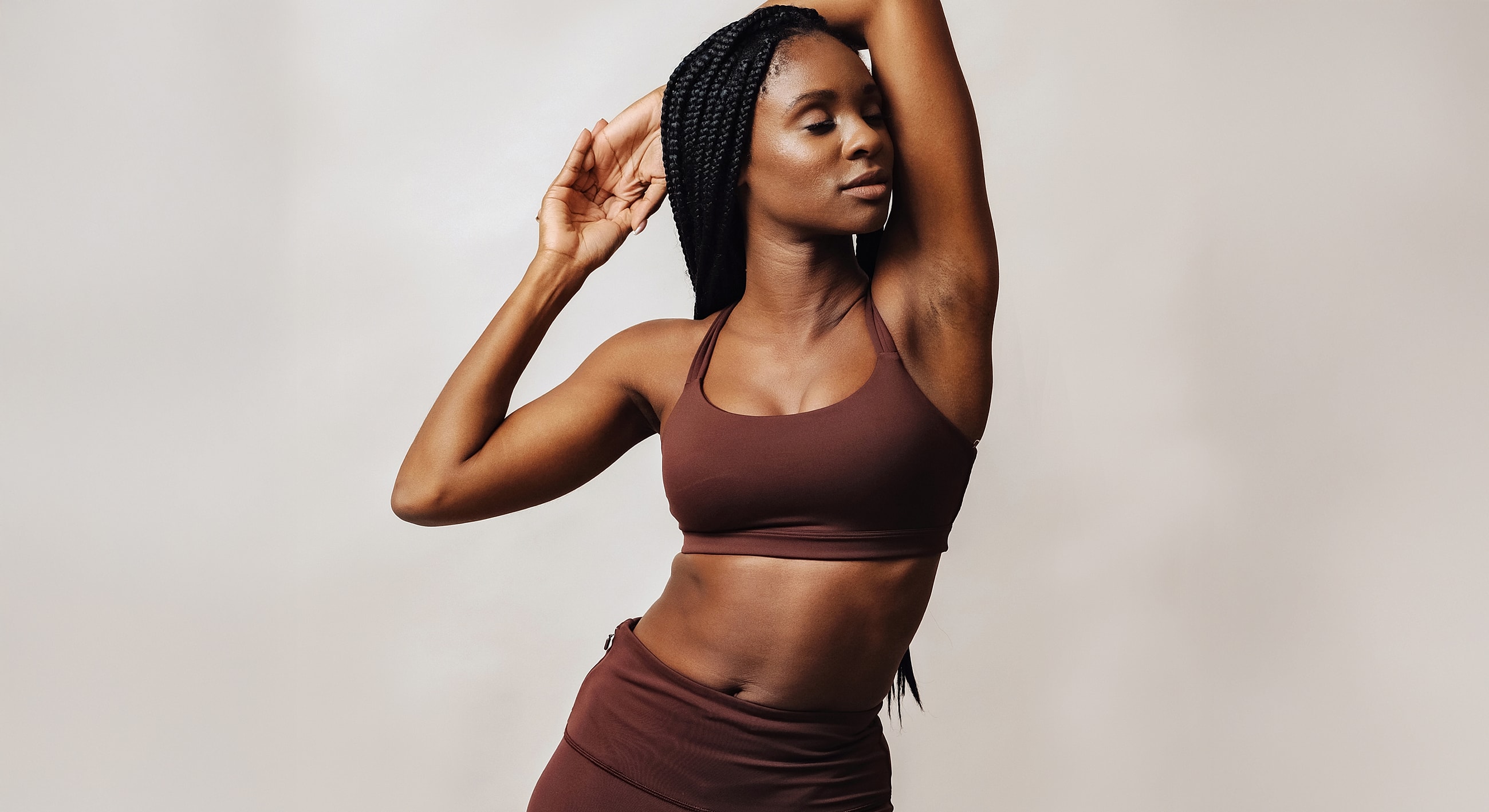 Woman in activewear posing gracefully.